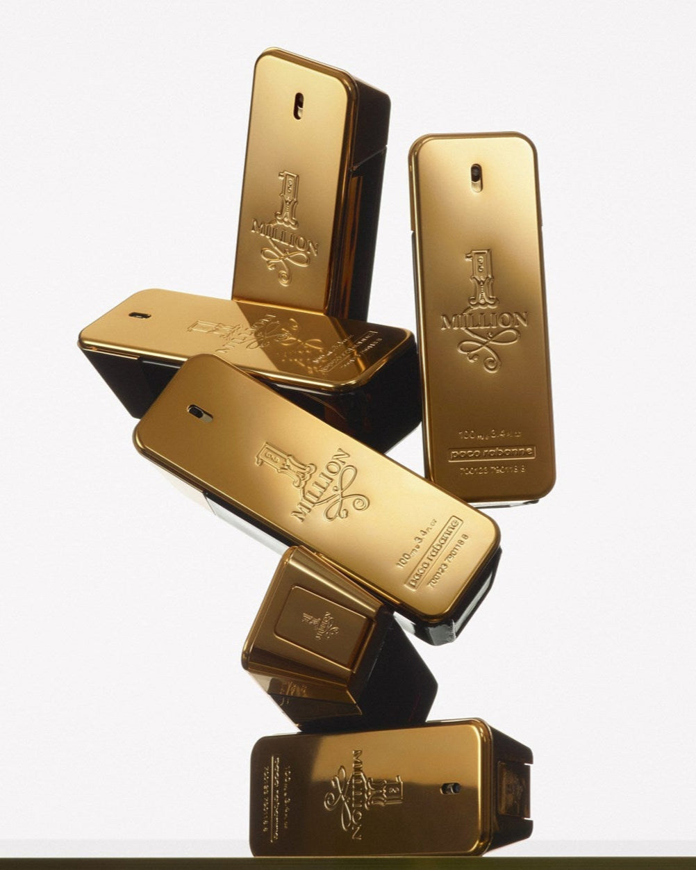 Gold bars stacked on a white background