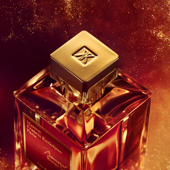 Luxurious perfume bottle with gold cap on a sparkling background