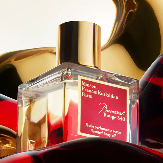 Maison Francis Kurkdjian perfume bottle with gold cap and red label.